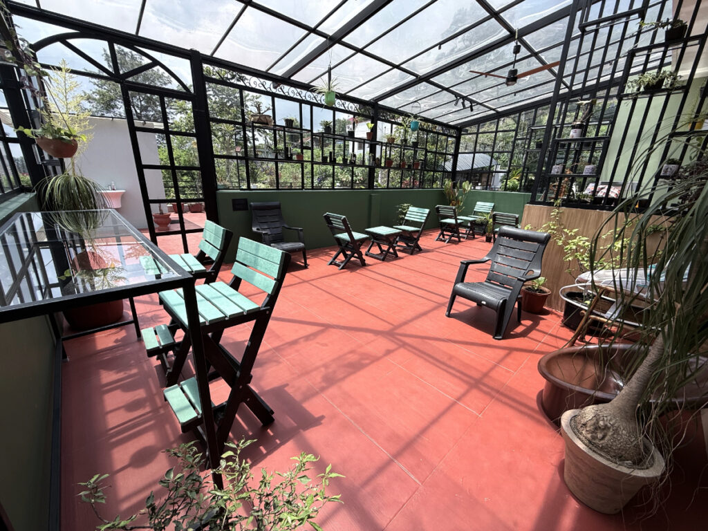 Indoor garden seating area at Jade Artefacts & Bistro Yercaud